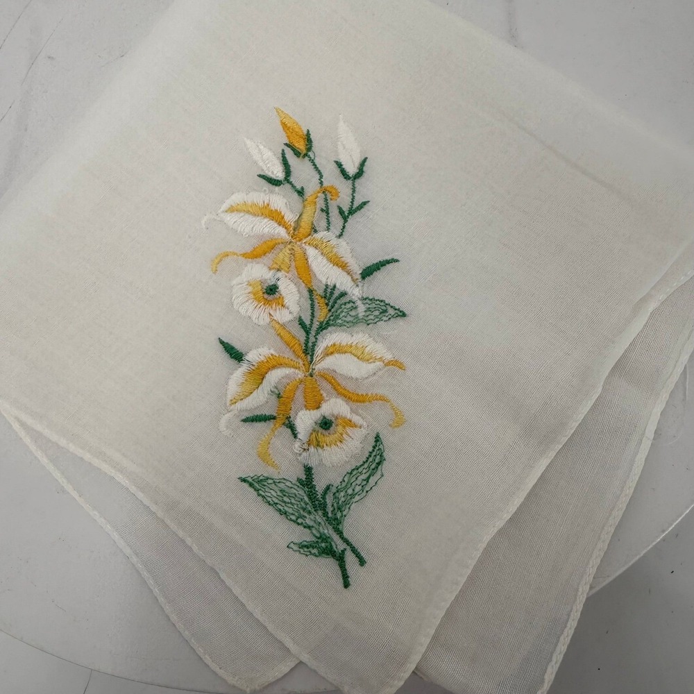 Vtg handkerchief featuring delicate yellow and green embroidered lily flowers. - Picture 2 of 4